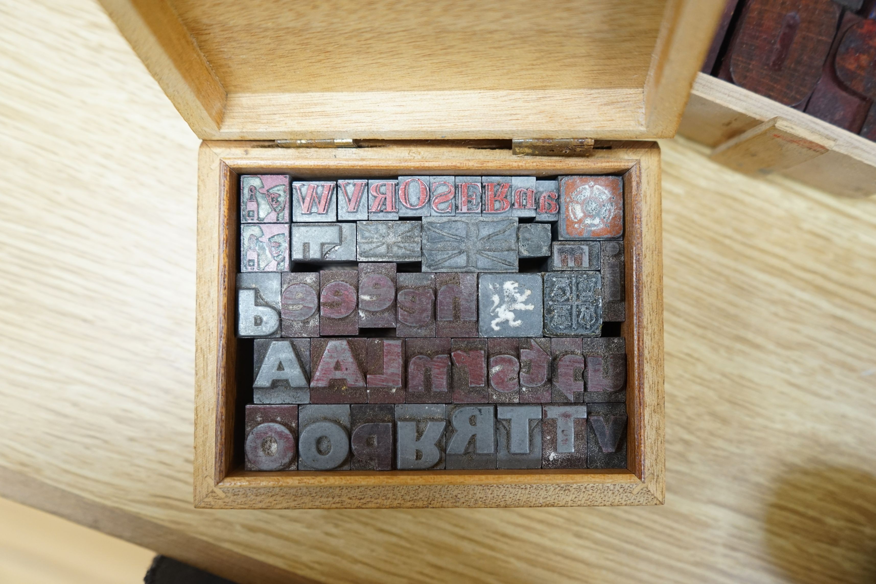 A collection metal letters and boxed printing blocks